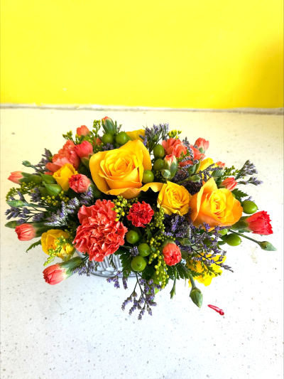 Vibrant Trough - A small, dainty tin trough with a beautiful selection of colourful flowers appearing from the top.